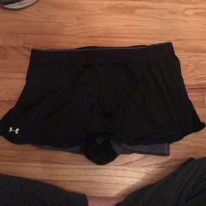 Black running shorts with built in gray spandex.